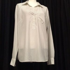 White button down shirt with black polka dots.
